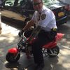 Photos: NYPD Officer Poses On Seized Mini Bike